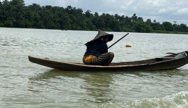Women of Odimodi Community-woman in a boat
