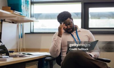 Man reading book or peer review of book